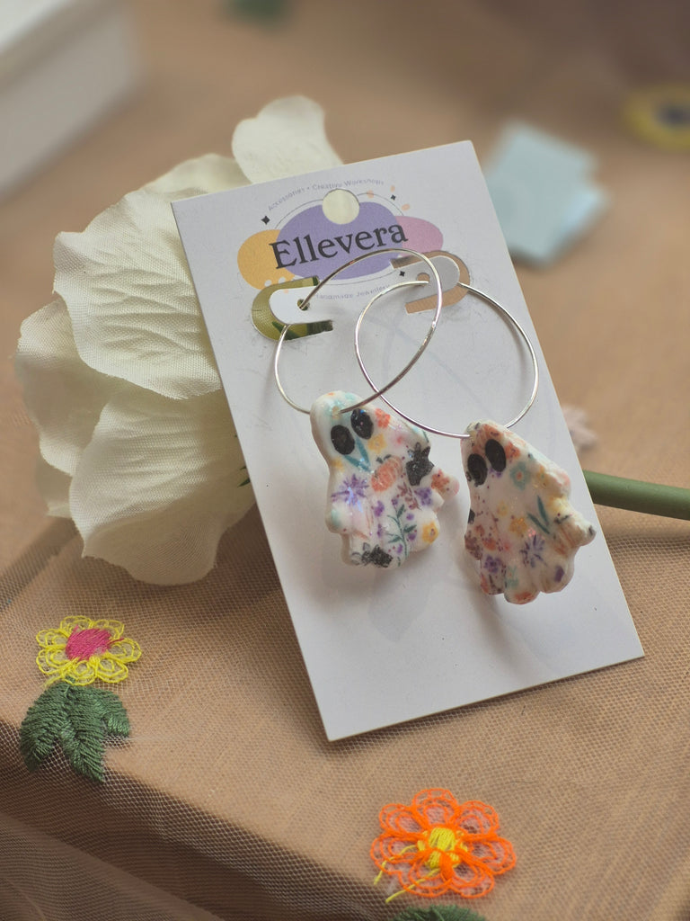 Handmade polymer clay floral ghost hoop earrings on silver hoops