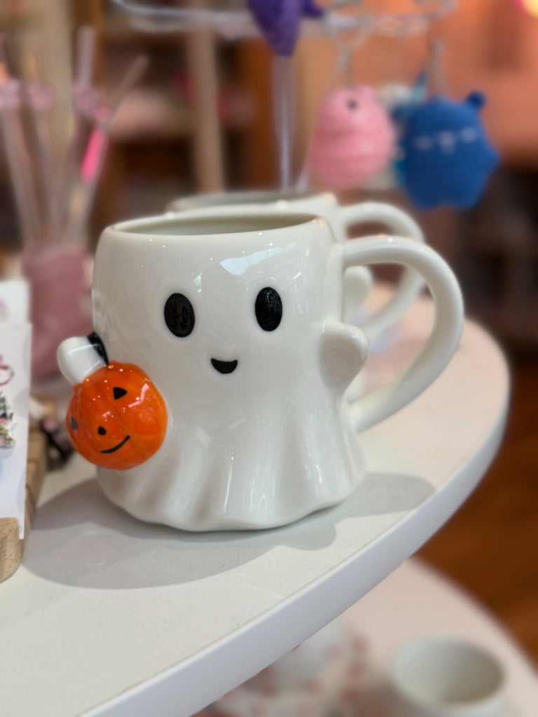 “Cute ceramic ghost mug with pumpkin basket – Halloween spooky homeware from Ellevera Emporium.”