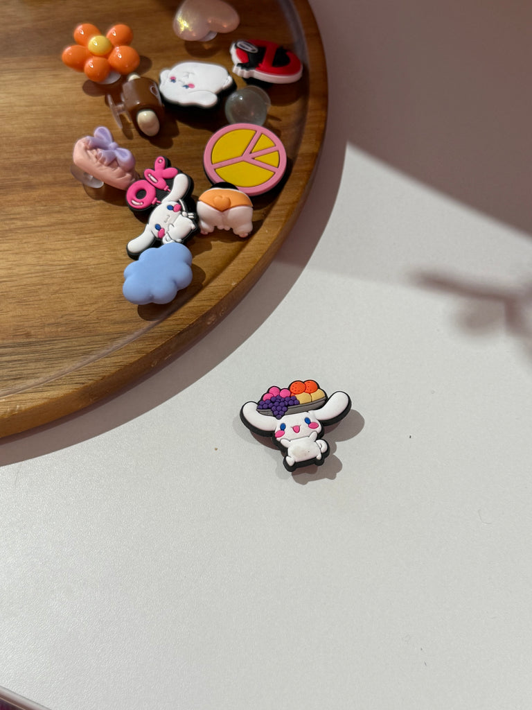 Bunny Croc charm wearing a colourful fruit basket hat.