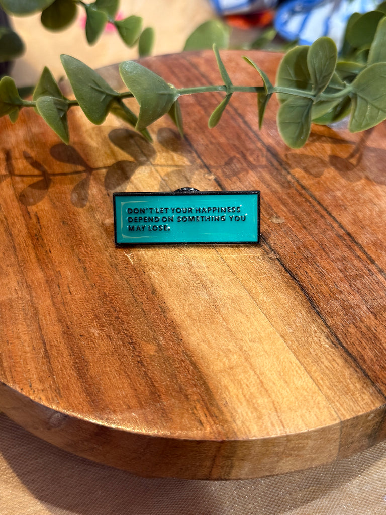 Don’t let your happiness depend on something you may lose enamel pin – teal background