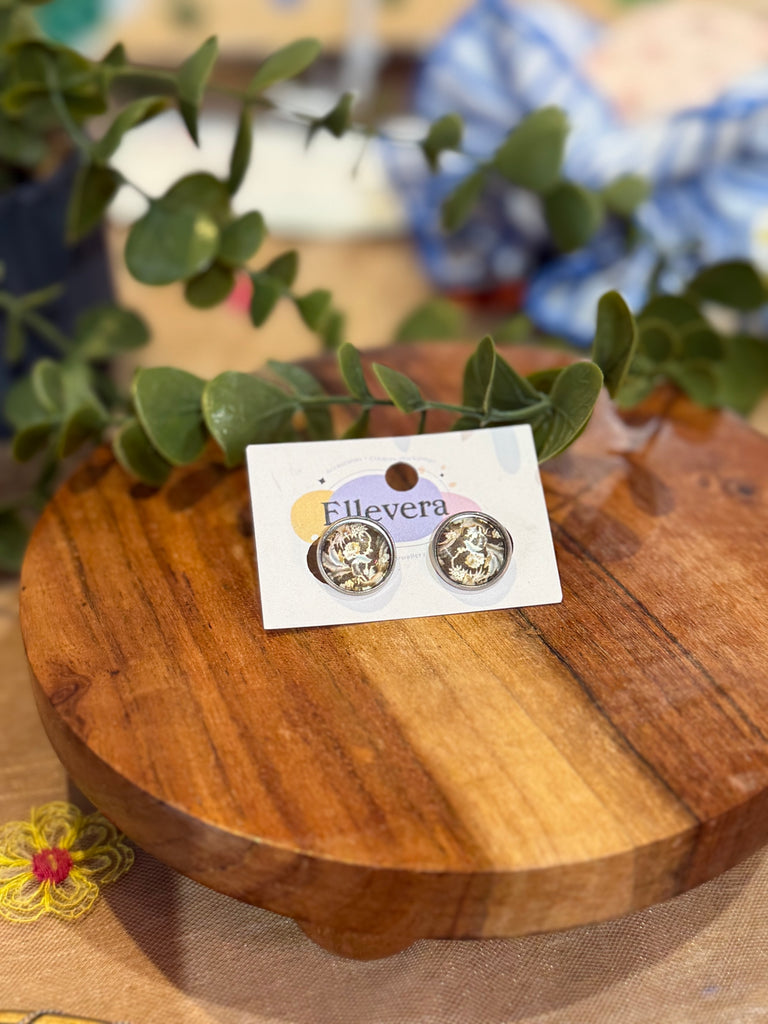 Round stud earrings with gold botanical leaf and flower pattern