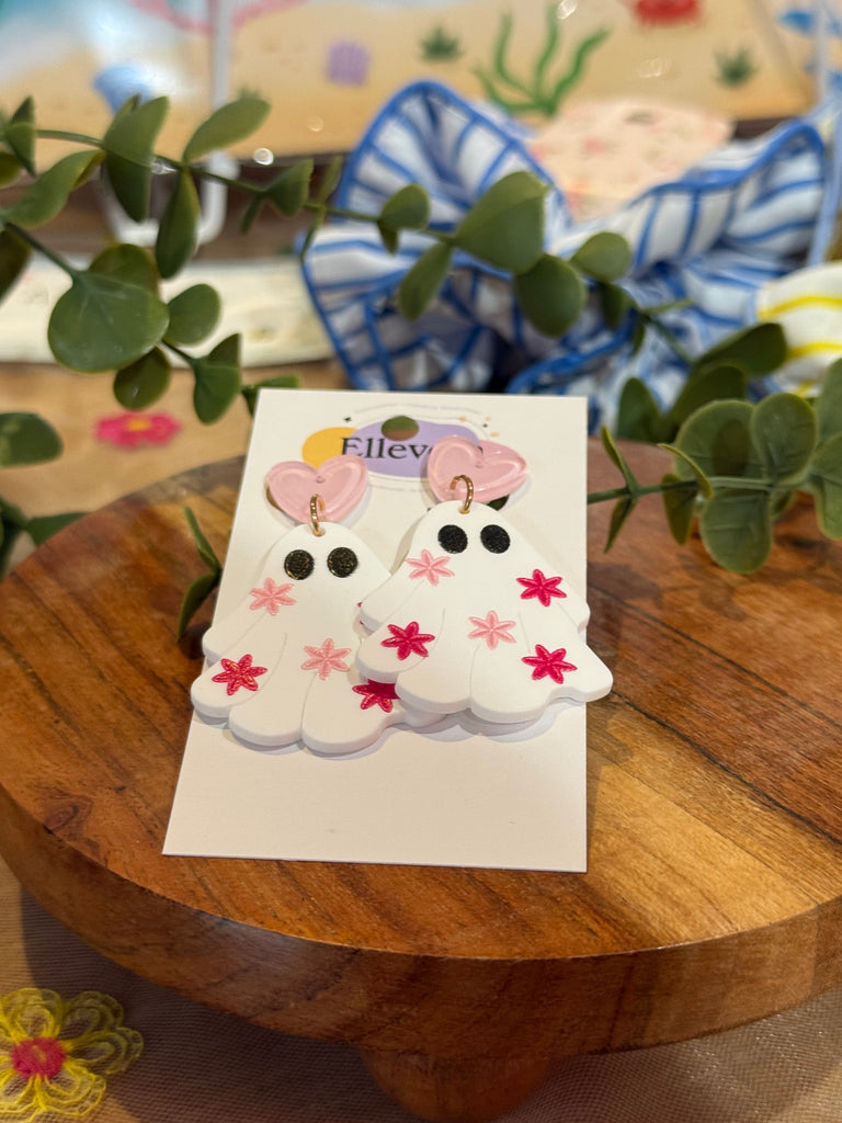 Acrylic ghost earrings with pink flowers and heart studs on Ellevera backing.