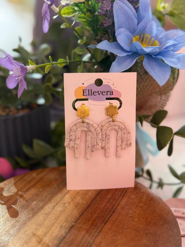 Elevate your look with Ellevera’s handmade neutral rainbow arch earrings with gold star tops – lightweight, modern, and effortlessly chic.