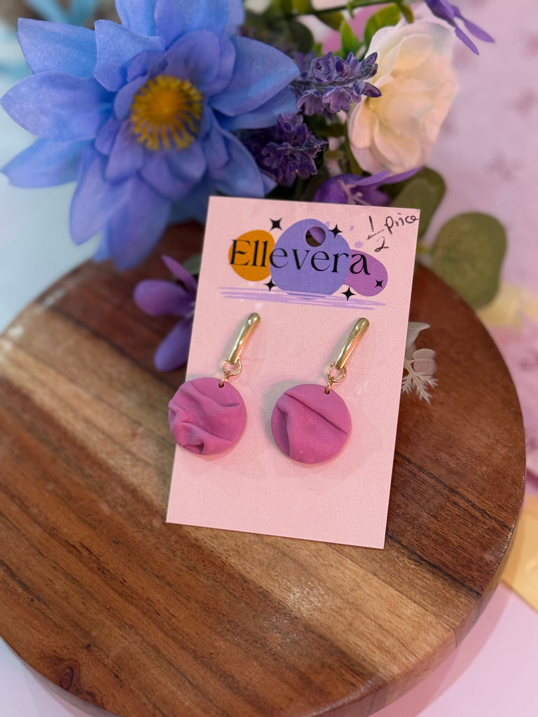 Handmade lilac and pink marble effect polymer clay earrings with gold hoops on Ellevera backing card.