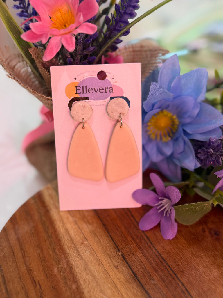 Handmade blush pink polymer clay drop earrings with round stud tops on Ellevera backing card