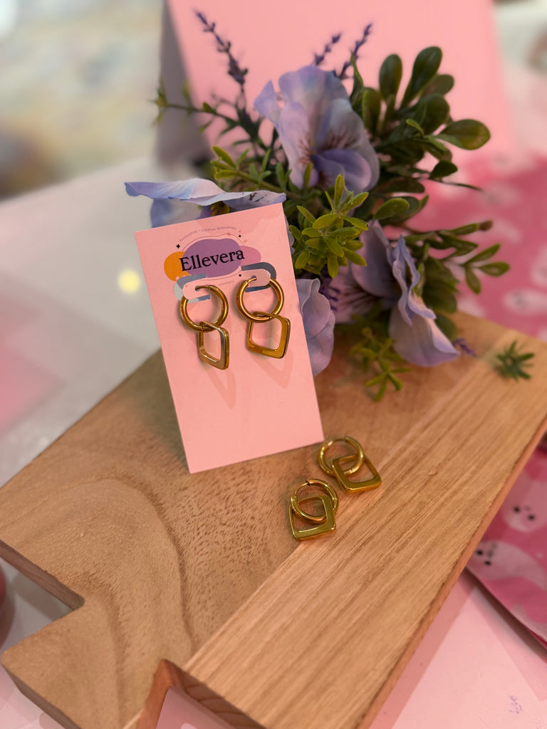Gold geometric double hoop earrings with linked circle and square design displayed on Ellevera card.