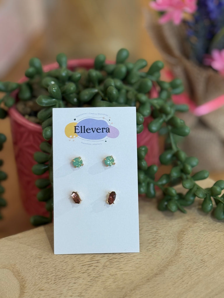 Two-pair gemstone stud earring set – emerald green studs and garnet red studs on Ellevera card.