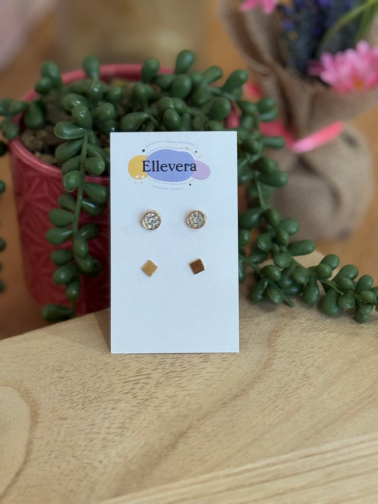 Two-pair stud earring set displayed on Ellevera card – one pair of crystal sparkle circle studs and one pair of gold square studs.
